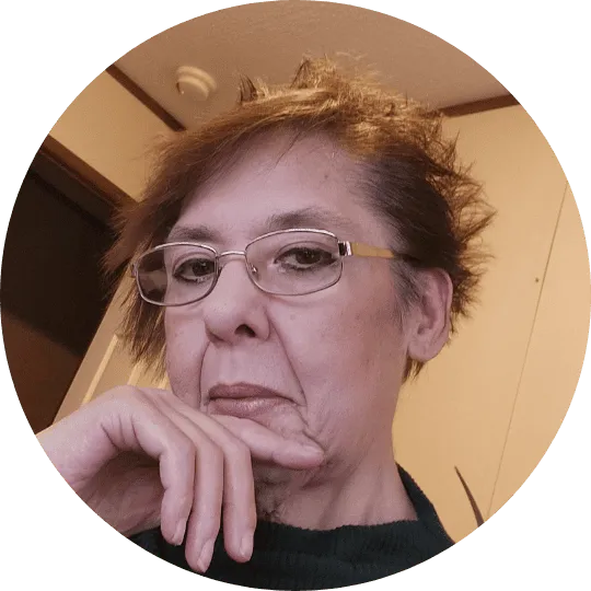 Pensive woman with glasses looking thoughtfully at the AppLuxe℠ app marketplace.