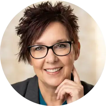 Professional woman with glasses smiling. App monetization strategies expert.